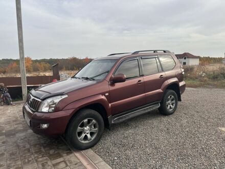 Красный Тойота Ленд Крузер Прадо 120, объемом двигателя 4 л и пробегом 280 тыс. км за 16500 $, фото 1 на Automoto.ua