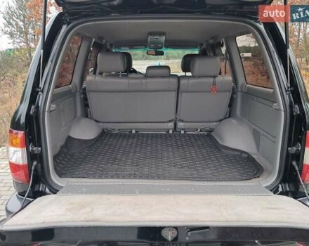 Черный Тойота Ленд Крузер, объемом двигателя 4.66 л и пробегом 337 тыс. км за 20700 $, фото 32 на Automoto.ua