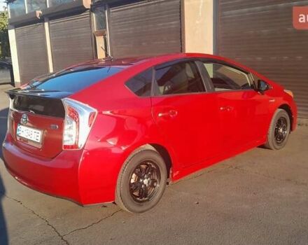 Красный Тойота Приус, объемом двигателя 1.8 л и пробегом 200 тыс. км за 10500 $, фото 1 на Automoto.ua
