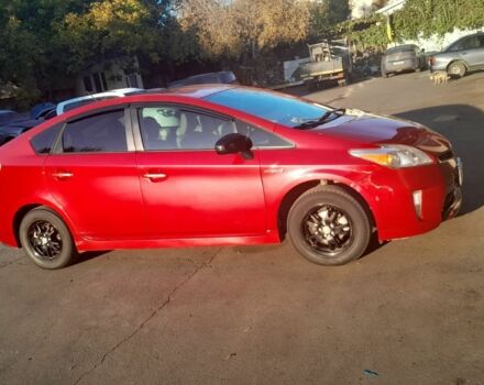 Красный Тойота Приус, объемом двигателя 1.8 л и пробегом 200 тыс. км за 10500 $, фото 1 на Automoto.ua