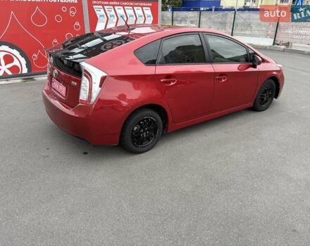 Красный Тойота Приус, объемом двигателя 1.8 л и пробегом 167 тыс. км за 12500 $, фото 1 на Automoto.ua