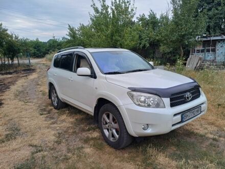 Белый Тойота РАВ 4, объемом двигателя 2.4 л и пробегом 244 тыс. км за 8900 $, фото 1 на Automoto.ua