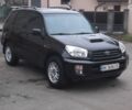 Черный Тойота РАВ 4, объемом двигателя 2 л и пробегом 400 тыс. км за 5500 $, фото 1 на Automoto.ua