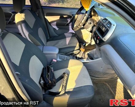 Черный Тойота РАВ 4, объемом двигателя 2 л и пробегом 493 тыс. км за 4999 $, фото 4 на Automoto.ua