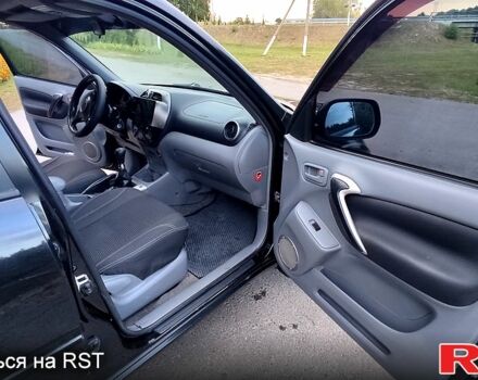 Чорний Тойота РАВ 4, об'ємом двигуна 2 л та пробігом 240 тис. км за 6299 $, фото 6 на Automoto.ua