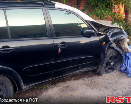 Черный Тойота РАВ 4, объемом двигателя 2 л и пробегом 280 тыс. км за 3000 $, фото 1 на Automoto.ua