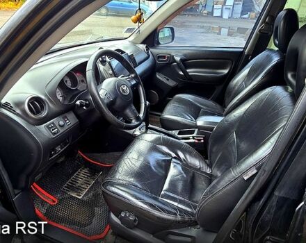 Черный Тойота РАВ 4, объемом двигателя 2 л и пробегом 224 тыс. км за 9000 $, фото 4 на Automoto.ua