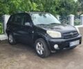 Черный Тойота РАВ 4, объемом двигателя 2 л и пробегом 193 тыс. км за 7600 $, фото 1 на Automoto.ua