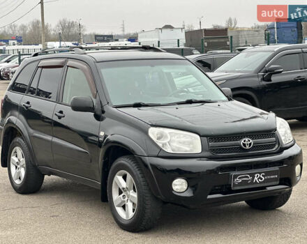 Черный Тойота РАВ 4, объемом двигателя 2 л и пробегом 243 тыс. км за 6900 $, фото 1 на Automoto.ua