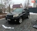 Черный Тойота РАВ 4, объемом двигателя 2 л и пробегом 305 тыс. км за 7000 $, фото 1 на Automoto.ua