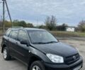 Черный Тойота РАВ 4, объемом двигателя 2 л и пробегом 300 тыс. км за 6000 $, фото 1 на Automoto.ua