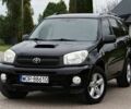 Черный Тойота РАВ 4, объемом двигателя 2 л и пробегом 210 тыс. км за 2600 $, фото 1 на Automoto.ua