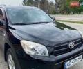 Черный Тойота РАВ 4, объемом двигателя 2 л и пробегом 157 тыс. км за 9300 $, фото 1 на Automoto.ua