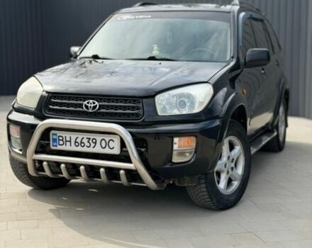 Черный Тойота РАВ 4, объемом двигателя 2 л и пробегом 400 тыс. км за 5700 $, фото 1 на Automoto.ua
