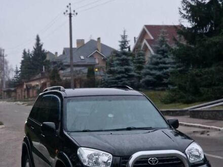 Чорний Тойота РАВ 4, об'ємом двигуна 2 л та пробігом 300 тис. км за 3800 $, фото 1 на Automoto.ua