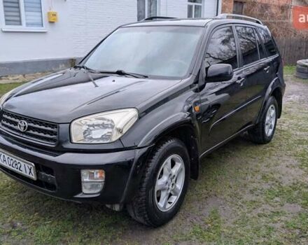 Черный Тойота РАВ 4, объемом двигателя 2 л и пробегом 406 тыс. км за 6000 $, фото 1 на Automoto.ua