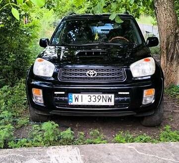 Чорний Тойота РАВ 4, об'ємом двигуна 2 л та пробігом 265 тис. км за 4500 $, фото 1 на Automoto.ua