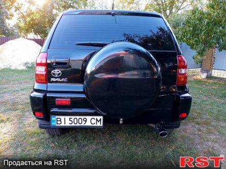 Чорний Тойота РАВ 4, об'ємом двигуна 2 л та пробігом 251 тис. км за 7100 $, фото 1 на Automoto.ua