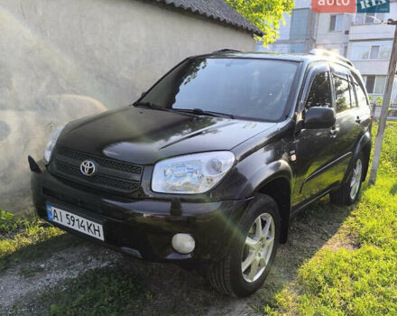 Черный Тойота РАВ 4, объемом двигателя 2 л и пробегом 320 тыс. км за 6550 $, фото 1 на Automoto.ua
