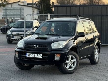 Черный Тойота РАВ 4, объемом двигателя 2 л и пробегом 260 тыс. км за 2400 $, фото 1 на Automoto.ua