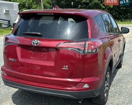 Червоний Тойота РАВ 4, об'ємом двигуна 2.49 л та пробігом 225 тис. км за 9600 $, фото 2 на Automoto.ua