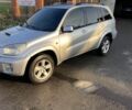 Серый Тойота РАВ 4, объемом двигателя 2 л и пробегом 244 тыс. км за 3650 $, фото 1 на Automoto.ua