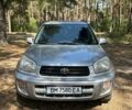 Серый Тойота РАВ 4, объемом двигателя 2 л и пробегом 305 тыс. км за 6000 $, фото 1 на Automoto.ua