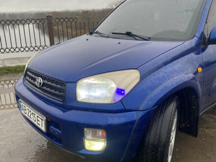 Синій Тойота РАВ 4, об'ємом двигуна 2 л та пробігом 244 тис. км за 6800 $, фото 1 на Automoto.ua