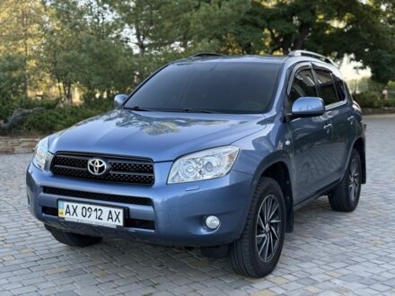 Синій Тойота РАВ 4, об'ємом двигуна 2 л та пробігом 124 тис. км за 12000 $, фото 1 на Automoto.ua