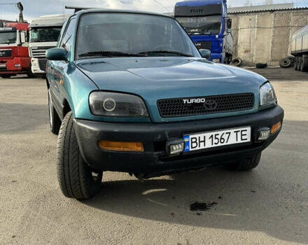 Зелений Тойота РАВ 4, об'ємом двигуна 2 л та пробігом 405 тис. км за 4999 $, фото 1 на Automoto.ua