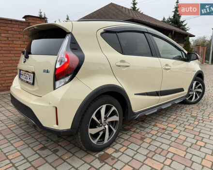 Бежевый Тойота Aqua, объемом двигателя 1.5 л и пробегом 90 тыс. км за 13700 $, фото 26 на Automoto.ua