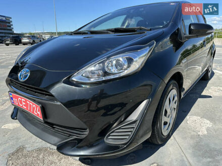 Чорний Тойота Aqua, об'ємом двигуна 1.5 л та пробігом 77 тис. км за 12500 $, фото 1 на Automoto.ua