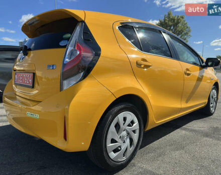 Желтый Тойота Aqua, объемом двигателя 1.5 л и пробегом 82 тыс. км за 13800 $, фото 1 на Automoto.ua