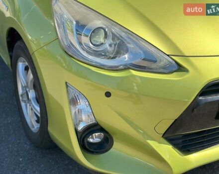 Зелений Тойота Aqua, об'ємом двигуна 1.5 л та пробігом 112 тис. км за 10940 $, фото 2 на Automoto.ua