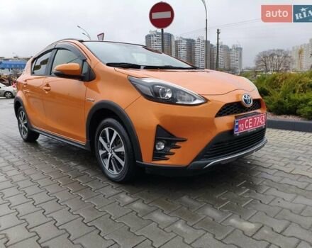 Оранжевый Тойота Aqua, объемом двигателя 1.5 л и пробегом 97 тыс. км за 13400 $, фото 1 на Automoto.ua