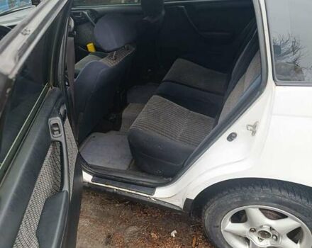 Білий Тойота Carina E, об'ємом двигуна 2.02 л та пробігом 388 тис. км за 1900 $, фото 4 на Automoto.ua