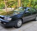 Чорний Тойота Carina E, об'ємом двигуна 1.6 л та пробігом 370 тис. км за 3198 $, фото 1 на Automoto.ua