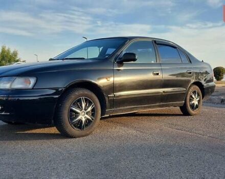 Черный Тойота Carina E, объемом двигателя 1.8 л и пробегом 443 тыс. км за 4000 $, фото 1 на Automoto.ua