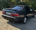 Черный Тойота Carina E, объемом двигателя 1.6 л и пробегом 450 тыс. км за 850 $, фото 1 на Automoto.ua