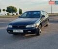Черный Тойота Carina E, объемом двигателя 1.8 л и пробегом 443 тыс. км за 4000 $, фото 1 на Automoto.ua