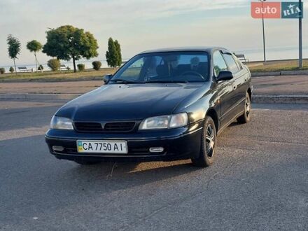 Черный Тойота Carina E, объемом двигателя 1.8 л и пробегом 443 тыс. км за 4000 $, фото 1 на Automoto.ua