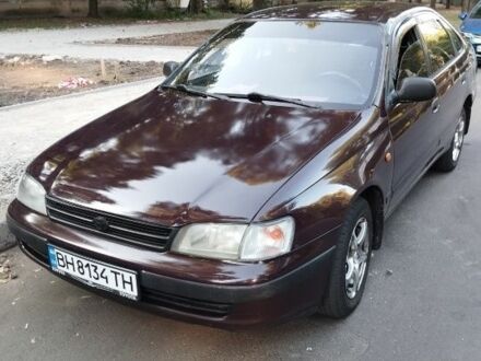 Коричневий Тойота Carina E, об'ємом двигуна 2 л та пробігом 300 тис. км за 2500 $, фото 1 на Automoto.ua