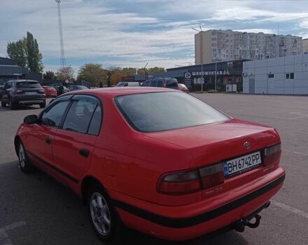 Червоний Тойота Carina E, об'ємом двигуна 2 л та пробігом 290 тис. км за 2300 $, фото 2 на Automoto.ua