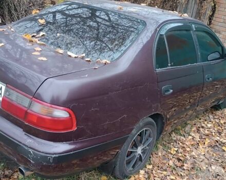 Червоний Тойота Carina E, об'ємом двигуна 1.6 л та пробігом 350 тис. км за 952 $, фото 8 на Automoto.ua