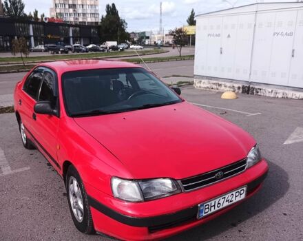 Червоний Тойота Carina E, об'ємом двигуна 2 л та пробігом 290 тис. км за 2300 $, фото 1 на Automoto.ua