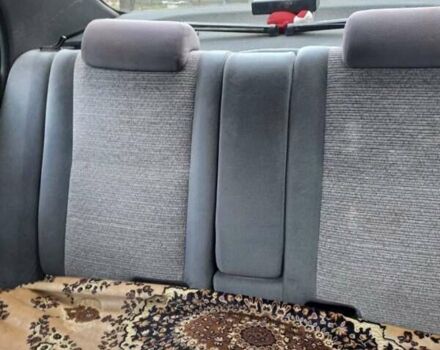 Красный Тойота Carina E, объемом двигателя 1.6 л и пробегом 450 тыс. км за 1150 $, фото 1 на Automoto.ua