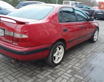 Червоний Тойота Carina E, об'ємом двигуна 1.6 л та пробігом 300 тис. км за 2670 $, фото 1 на Automoto.ua