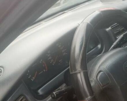 Красный Тойота Carina E, объемом двигателя 1.6 л и пробегом 450 тыс. км за 1150 $, фото 4 на Automoto.ua