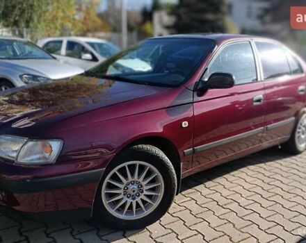 Червоний Тойота Carina E, об'ємом двигуна 2 л та пробігом 260 тис. км за 4500 $, фото 5 на Automoto.ua