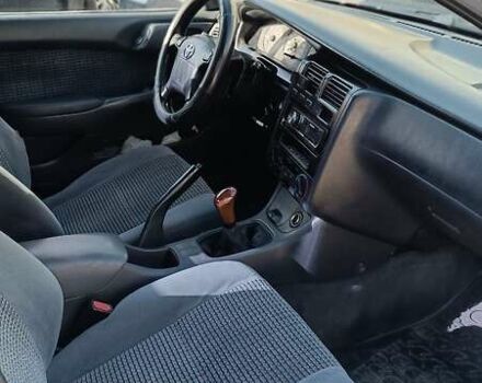 Червоний Тойота Carina E, об'ємом двигуна 2 л та пробігом 260 тис. км за 4500 $, фото 2 на Automoto.ua